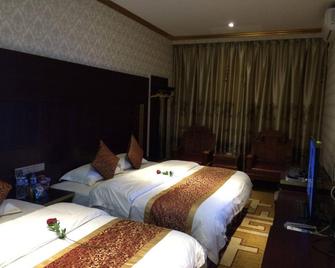 Sanlong Hotel in Kaiyuan City - Honghe - Habitación