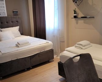 Hotel Franken an der Messe - פרנקפורט אם מיין - חדר שינה