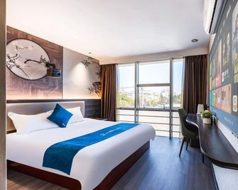 Home Inn Huayi Hotel (Suzhou Xiangcheng Xutugang Metro Station Branch) - Suzhou - Bedroom