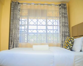 Lux Suites J'Melots Apartments Kisumu - Kisumu - Bedroom