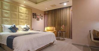 Yijia City Hotel (Mianyang Tieniu Square) - Mianyang - Camera da letto