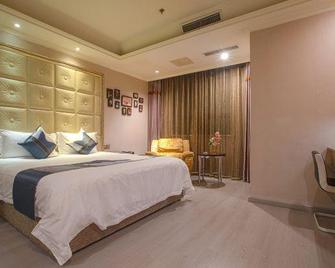 Yijia City Hotel (Mianyang Tieniu Square) - Mianyang - Bedroom