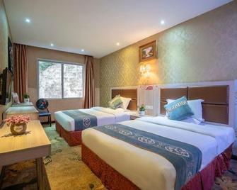 Kerry Garten Fashion Hotel - Qiandongnan - Bedroom