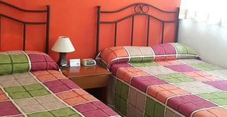 Hotel Casa Flores De Tikal - Santa Elena - Bedroom