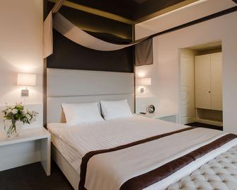 UNO Design Hotel - אודסה - חדר שינה