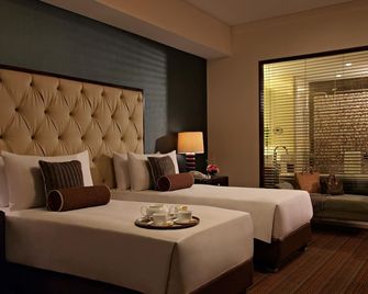 Joy Nostalg Hotel and Suites Manila Managed by The Ascott Limited - Pasig - Habitación