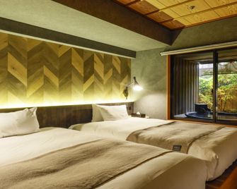 Yoshidaya Sannoukaku Ryokan - Kaga - Bedroom