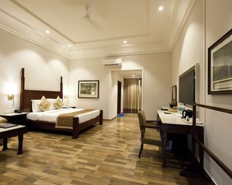 Chanakya Bnr Hotel - פורי - חדר שינה