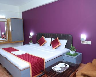 Grand Harmony Beach Resort - Kovalam - Schlafzimmer