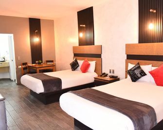 American Inn Hotel & Suites Parral - Parral - Slaapkamer