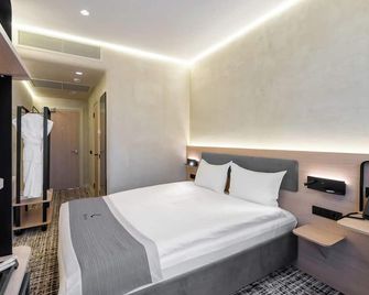 Renion City Hotel - Almatý - Habitación