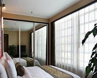 Qingdao Blue Horizon Hotel - Laoshan - צ'ינגדאו - חדר שינה