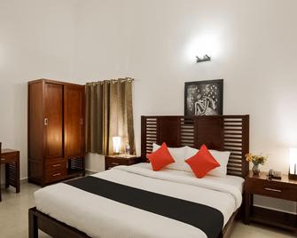 Capital O 40286 Lush Garden Resort - Covelong - Habitación
