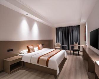 تيانجين جالاكسي هوتل - تيانجين - غرفة نوم