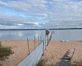 The beach is callingright outside your window come relax and play - Shell Lake - Beach