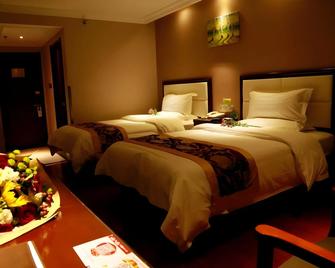 Greentree Inn Jinan Gaoxin District International Convention Centre Business Hotel - Jinan - Schlafzimmer