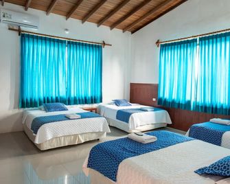 Hotel La Gran Tortuga - Puerto Villamil - Camera da letto