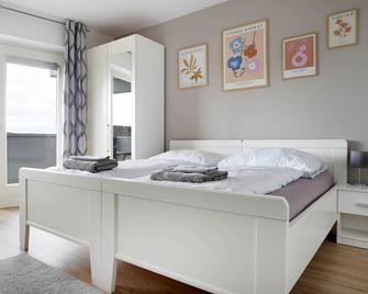 Schöne Apartments in Bad Rothenfelde I private Parkplätze mit Ladesäulen I home2share - Bad Rothenfelde - Schlafzimmer