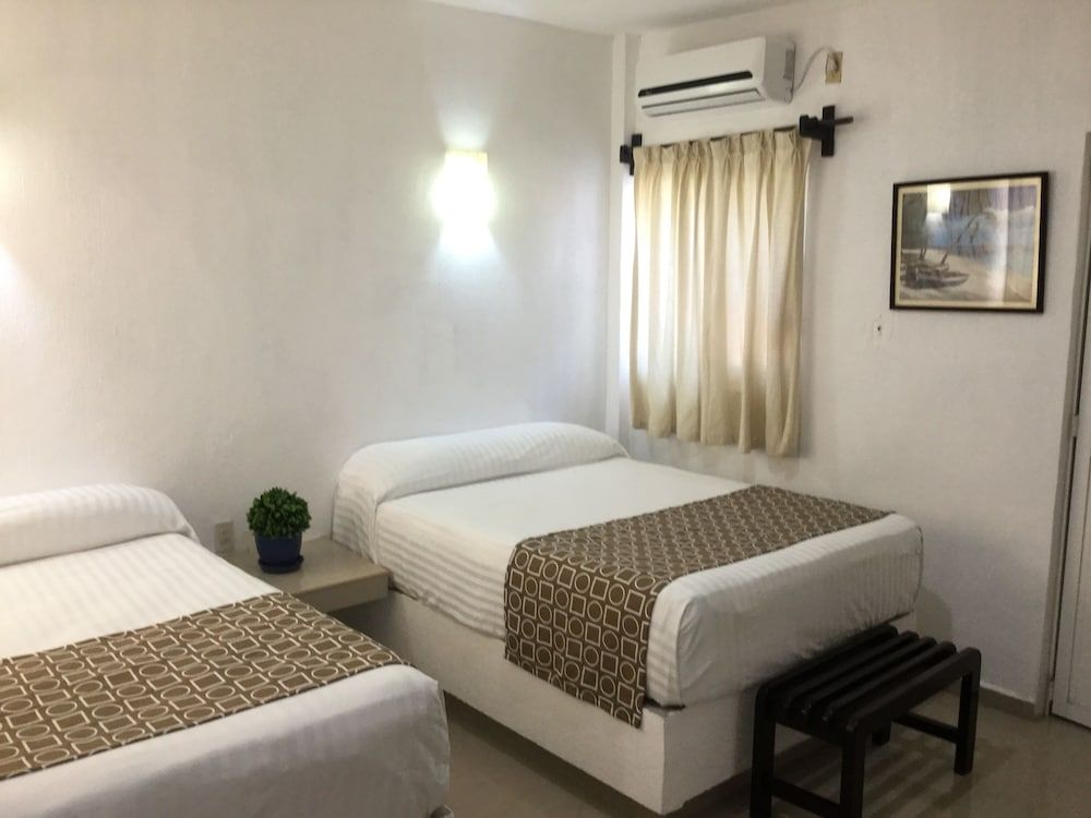 هوتل أريستا بوجامبيلياس - Puerto Arista - غرفة نوم