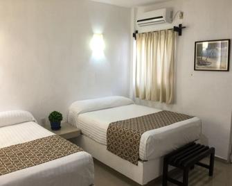 هوتل أريستا بوجامبيلياس - Puerto Arista - غرفة نوم