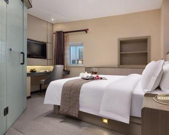 Hans Elegant Hotel Zhuzhou (Railway Station Clothing Market Center Plaza) - Zhuzhou - Спальня