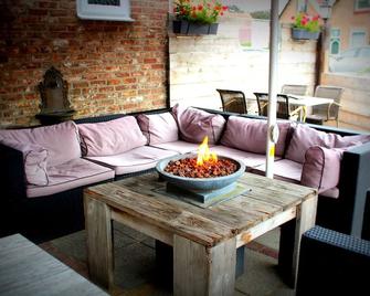Eetcafe Pension 't Overleg - Groede - Wohnzimmer