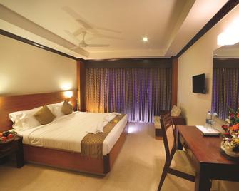 Hotel Zodiac Regency - Perumanseri - Bedroom