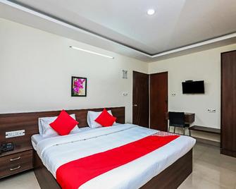 OYO 24891 Orchid Inn - Vīrarājendrapet - Slaapkamer