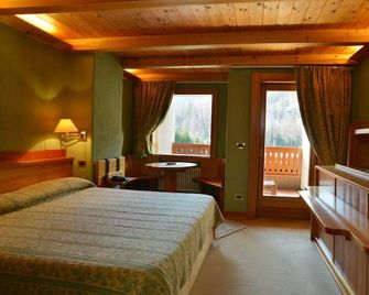 Eco Wellness Hotel Notre Maison - Cogne - Camera da letto