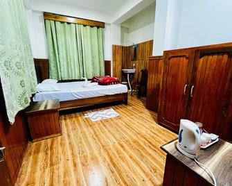 Hotel Tashi Gyal Tsen - Pelling - Schlafzimmer
