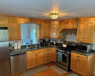 Experience coastal living! This home features water views on every level. - East Haven - Kitchen