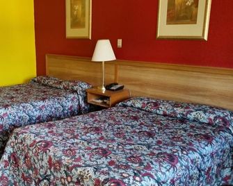 Land of Ahs Motor Inn - Erie - Спальня
