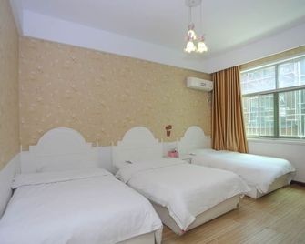 Aishang Hostel - Zhangjiajie - Schlafzimmer