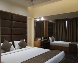 Hotel Heritage Dakshin - นาวี มุมไบ - ห้องนอน