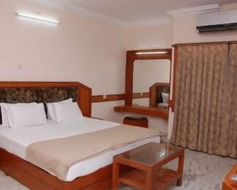 Amogha International Hotel - Chitradurga - Bedroom