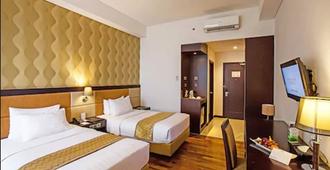 Beston Hotel Palembang - Palembang - Bedroom