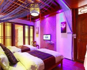 Lansha Xinyuan Boutique Homestay - Li-ťiang - Ložnice