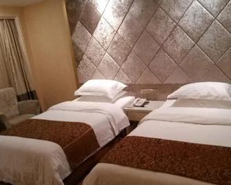 Shishi Wanjia Oriental Hotel - Quanzhou - Bedroom