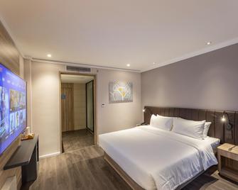 Hanting Premium Hotel Taizhou Wanda Plaza - Taizhou - Bedroom