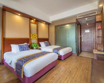 Chongqing Jinxiu Baiyun Hotel (Qinggang Middle School Branch) - Chongqing - Bedroom