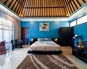 Rossa Garden Hotel - Manggis - חדר שינה