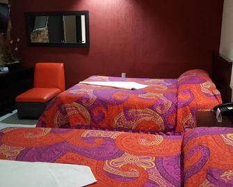 هوتل مكاريوس - توكستلا جوتيريز - غرفة نوم