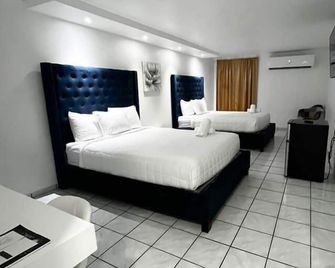 Douglas Highway Inn Hotel - Cabo Rojo - Schlafzimmer