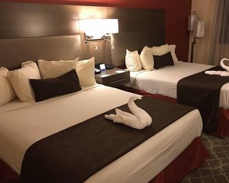 American Inn & Suites West Memphis I-40/I-55 - West Memphis - Schlafzimmer