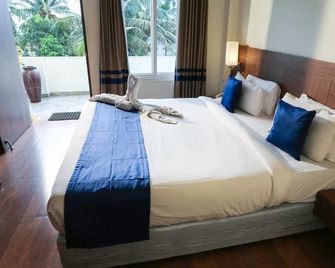 Sai Priya Beach Resort - ויסאקאפאטנם - חדר שינה