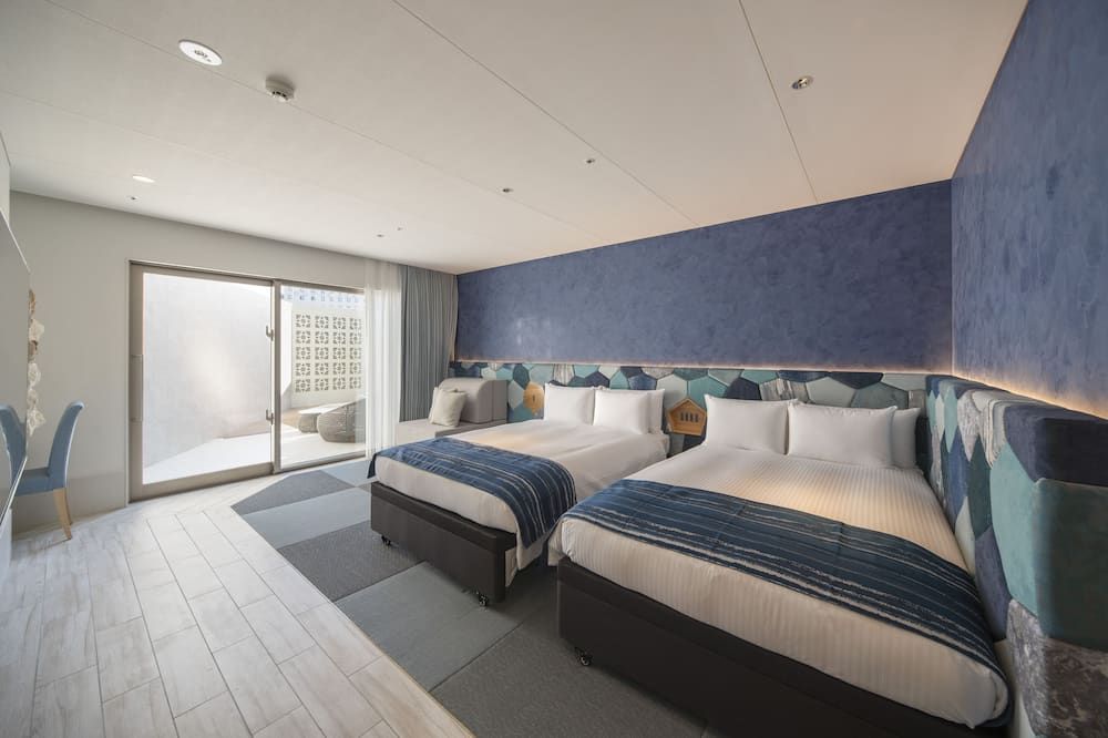 Okinawa Hinode Resort & Hot Spring Hotel - נאהא - חדר שינה