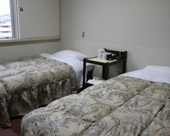 Omagari City Hotel - דשאן - חדר שינה