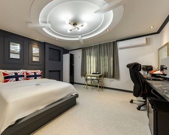 Iksan Hotel G7 - Iksan - Bedroom