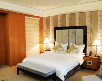 Oriental Lily Hotel - Lüliang - Bedroom