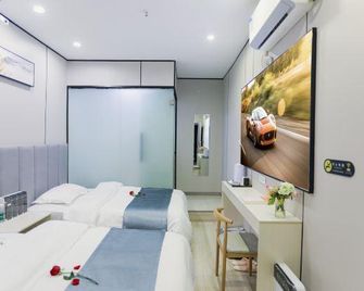 Nan Xin Hotel - Wuhan - Makuuhuone